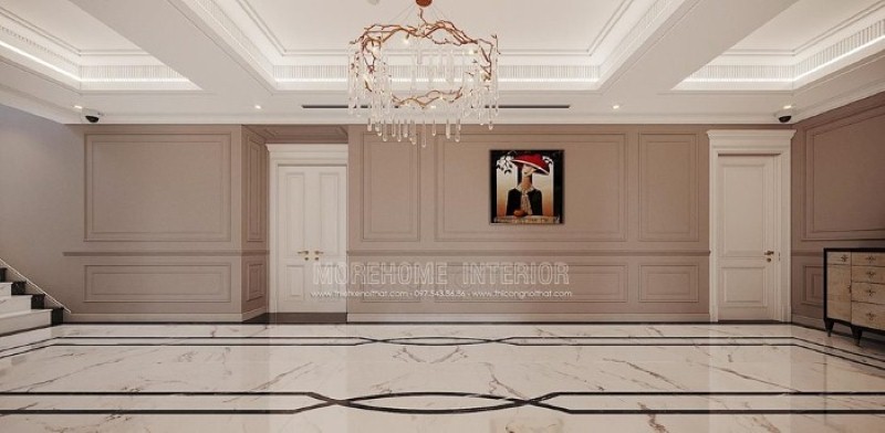 Trang trí hành lang đẹp ấn tượng với họa tiết độc đáo từ sàn lát đá cùng đường chỉ tường ấn tượng, bức tranh điểm nhấn kết hợp với nét tinh tế từ đèn trần cao cấp. thiết kế thi công nội thất cao cấp